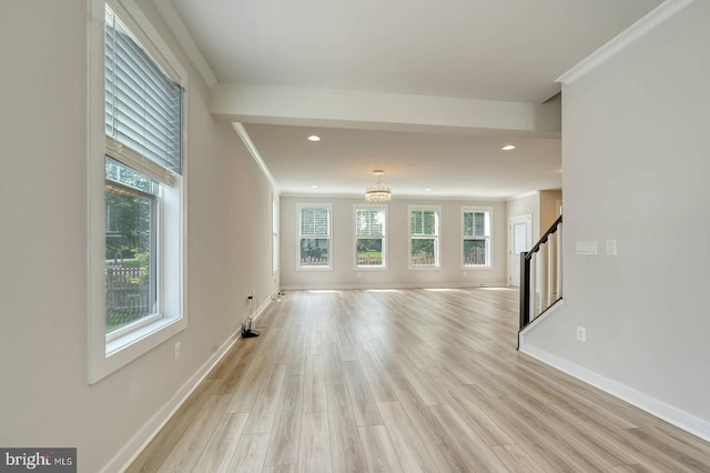 20769 Partlows Store Sq, Ashburn, VA 20147 - unfurnished living room featuring stairway, light wood-type flooring, a chandelier, recessed lighting, and ornamental molding