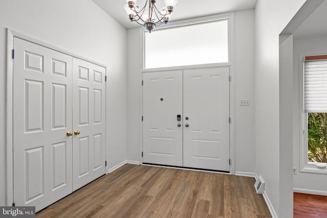951 Robin Ln, Huntingdon Valley, PA 19006 - entryway featuring a chandelier and wood finished floors