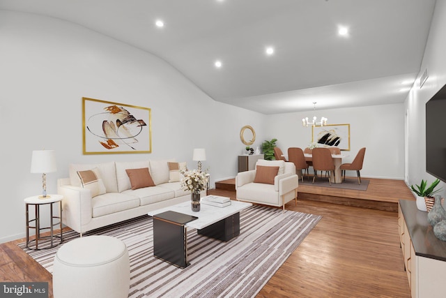 951 Robin Ln, Huntingdon Valley, PA 19006 - living room featuring vaulted ceiling, wood finished floors, recessed lighting, and a chandelier