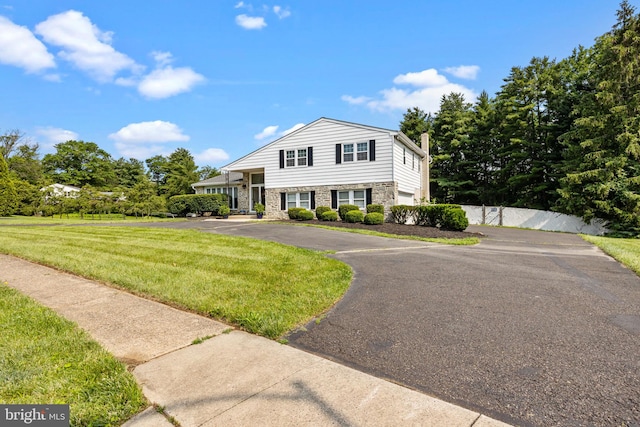 951 Robin Ln, Huntingdon Valley, PA 19006 - split level home featuring driveway, a chimney, and stone siding