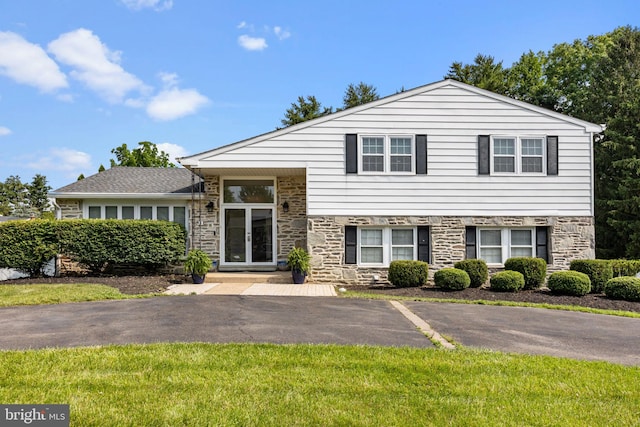 951 Robin Ln, Huntingdon Valley, PA 19006 - view of front of house with stone siding and uncovered parking