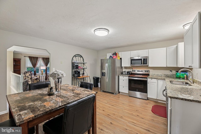 41 Sycamore Ln, Hanover, PA 17331 - kitchen featuring stainless steel appliances, light wood-type flooring, light stone countertops, and white cabinetry