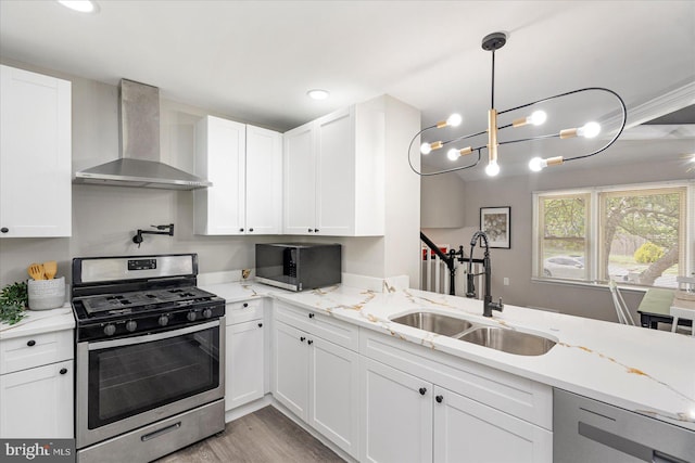 1427 Perrywood Dr, Aberdeen, MD 21001 - kitchen with stainless steel appliances, wall chimney exhaust hood, white cabinets, light wood-style flooring, and recessed lighting