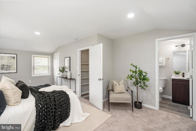 1427 Perrywood Dr, Aberdeen, MD 21001 - bedroom with vaulted ceiling, a walk in closet, light carpet, recessed lighting, and connected bathroom