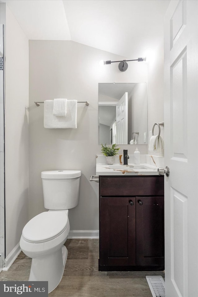 1427 Perrywood Dr, Aberdeen, MD 21001 - bathroom with vanity, wood finished floors, and lofted ceiling