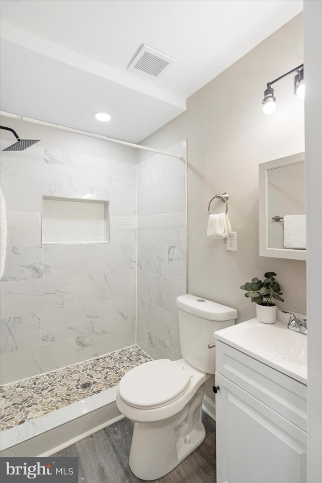 1427 Perrywood Dr, Aberdeen, MD 21001 - bathroom featuring vanity, a tile shower, and wood finished floors