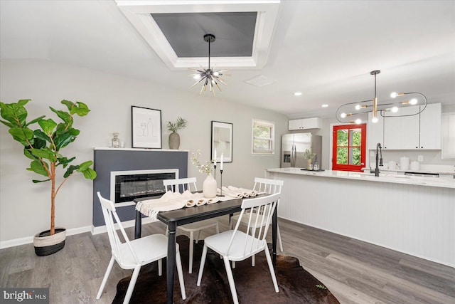 1427 Perrywood Dr, Aberdeen, MD 21001 - dining area featuring a chandelier, wood finished floors, and a glass covered fireplace