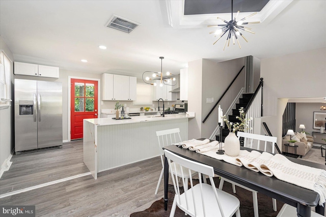 1427 Perrywood Dr, Aberdeen, MD 21001 - dining space featuring a chandelier, light wood-type flooring, stairs, and recessed lighting