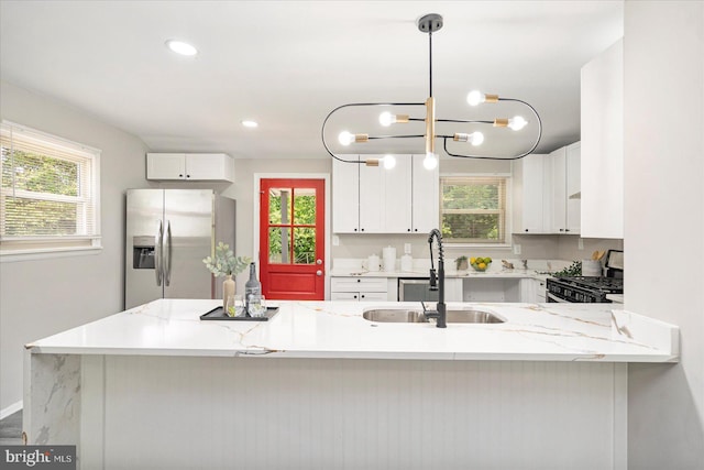1427 Perrywood Dr, Aberdeen, MD 21001 - kitchen featuring stainless steel refrigerator with ice dispenser, gas range oven, white cabinets, a peninsula, and recessed lighting