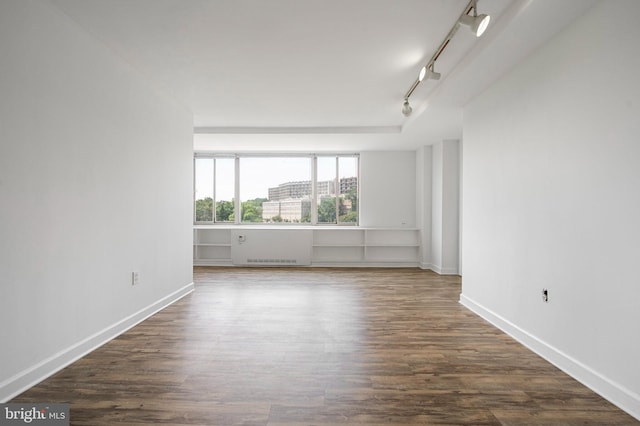 1111 Arlington Blvd Unit 707, Arlington, VA 22209 - unfurnished room featuring rail lighting and dark wood-type flooring