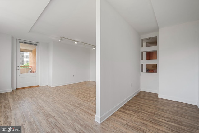 1111 Arlington Blvd Unit 707, Arlington, VA 22209 - empty room featuring wood finished floors and rail lighting