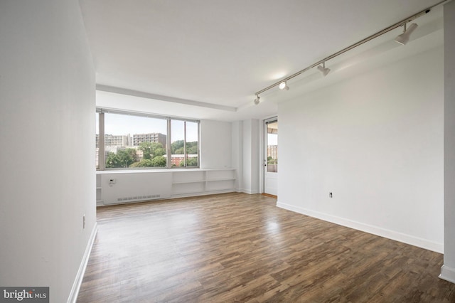 1111 Arlington Blvd Unit 707, Arlington, VA 22209 - unfurnished room with wood finished floors and track lighting