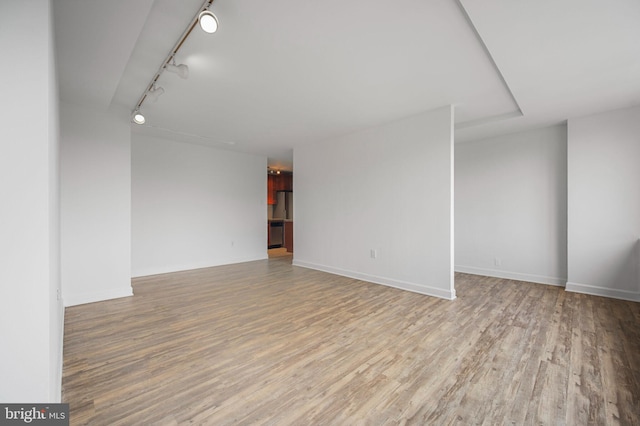 1111 Arlington Blvd Unit 707, Arlington, VA 22209 - unfurnished room with wood finished floors and track lighting