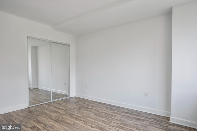 1111 Arlington Blvd Unit 707, Arlington, VA 22209 - unfurnished bedroom featuring wood finished floors and a closet