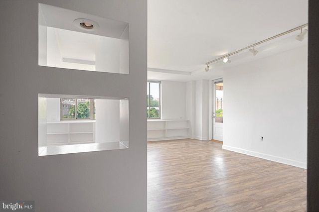 1111 Arlington Blvd Unit 707, Arlington, VA 22209 - empty room with wood finished floors and track lighting