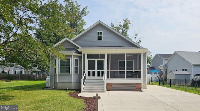 201 Lawrence Ln, Colonial Beach, VA 22443 - view of front of house with a sunroom and roof with shingles