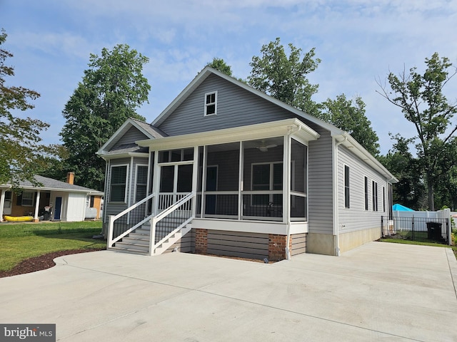 201 Lawrence Ln, Colonial Beach, VA 22443 - view of front of home featuring a sunroom and concrete driveway
