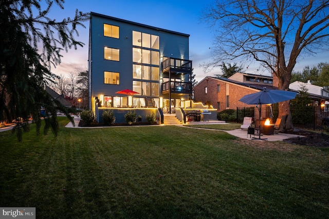 110 Rue Du Boise, Cherry Hill, NJ 08003 - back of house at dusk featuring a balcony, a patio area, and a jacuzzi