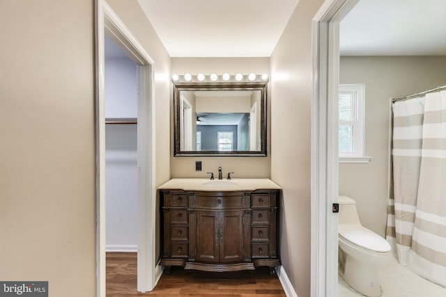 6260 Alpine Ct, Sunderland, MD 20689 - full bath with wood finished floors, vanity, and a shower with curtain