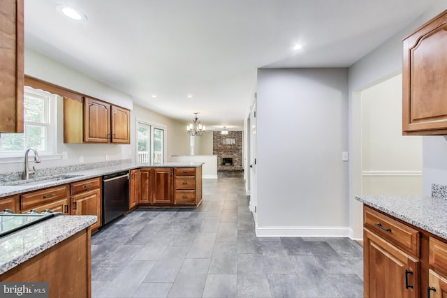 6260 Alpine Ct, Sunderland, MD 20689 - kitchen with stainless steel dishwasher, healthy amount of natural light, light stone counters, a chandelier, and recessed lighting