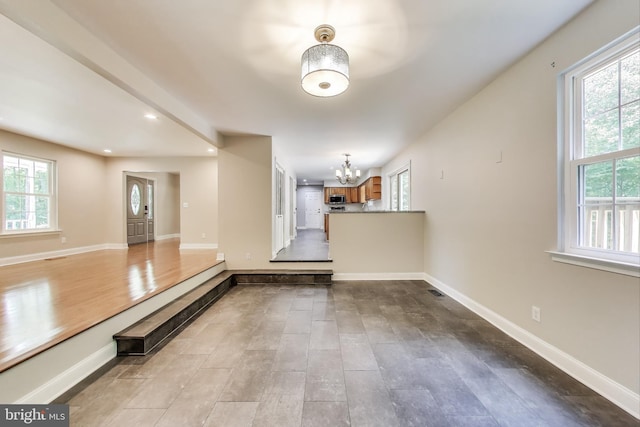 6260 Alpine Ct, Sunderland, MD 20689 - unfurnished living room featuring a chandelier, plenty of natural light, and recessed lighting