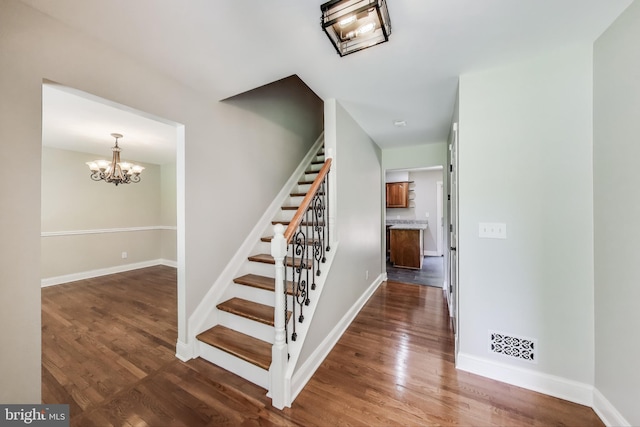 6260 Alpine Ct, Sunderland, MD 20689 - stairs with wood finished floors and a chandelier
