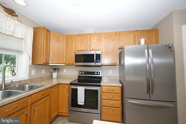 22890 Zoar Rd, Georgetown, DE 19947 - kitchen with stainless steel appliances, light countertops, and light tile patterned flooring
