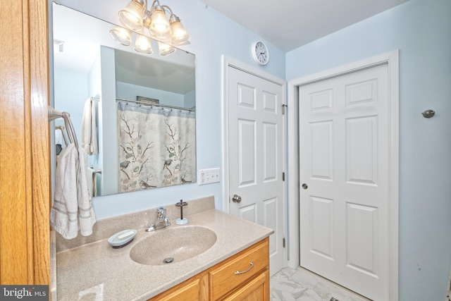22890 Zoar Rd, Georgetown, DE 19947 - bathroom featuring vanity, a chandelier, and marble look tiles
