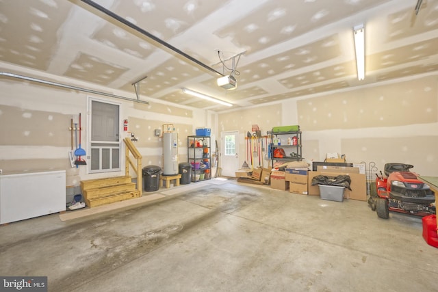22890 Zoar Rd, Georgetown, DE 19947 - garage featuring a garage door opener and water heater