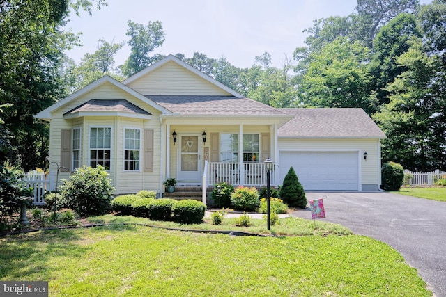 22890 Zoar Rd, Georgetown, DE 19947 - view of front of house with asphalt driveway, a porch, an attached garage, and a shingled roof