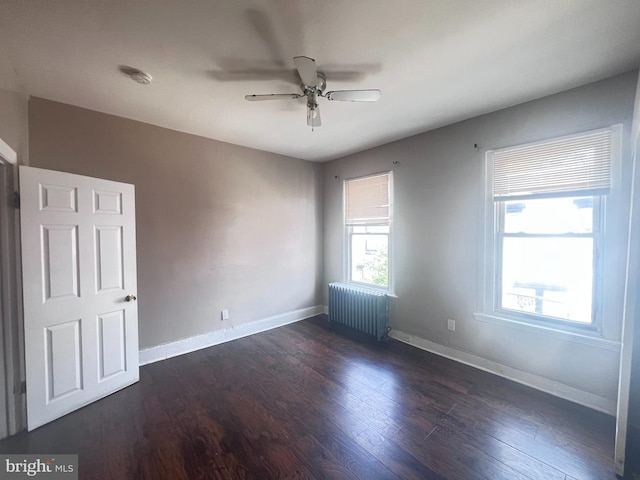 2238 N Bancroft St, Philadelphia, PA 19132 - unfurnished room featuring radiator, ceiling fan, wood finished floors, and a smoke detector