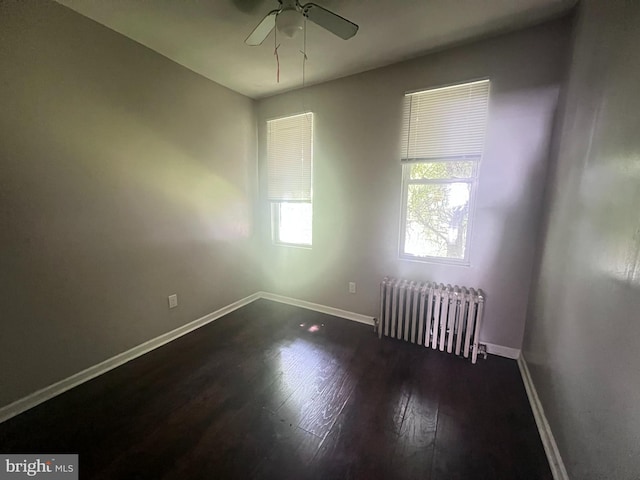 2238 N Bancroft St, Philadelphia, PA 19132 - unfurnished room with radiator heating unit, dark wood finished floors, and ceiling fan