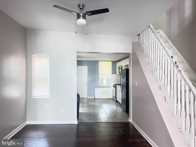 2238 N Bancroft St, Philadelphia, PA 19132 - interior space featuring ceiling fan, plenty of natural light, stairs, and dark wood-type flooring