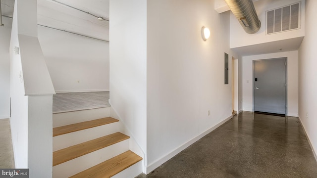 444 N 4th St Unit 401, Philadelphia, PA 19123 - staircase with concrete flooring, electric panel, and a towering ceiling