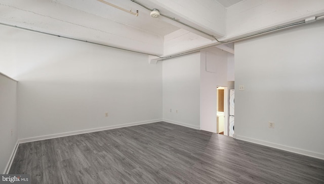 444 N 4th St Unit 401, Philadelphia, PA 19123 - spare room with estacked washer and dryer and wood finished floors