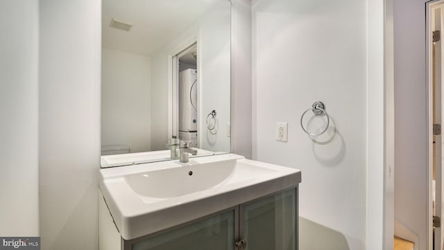 444 N 4th St Unit 401, Philadelphia, PA 19123 - bathroom with stacked washer and clothes dryer and vanity