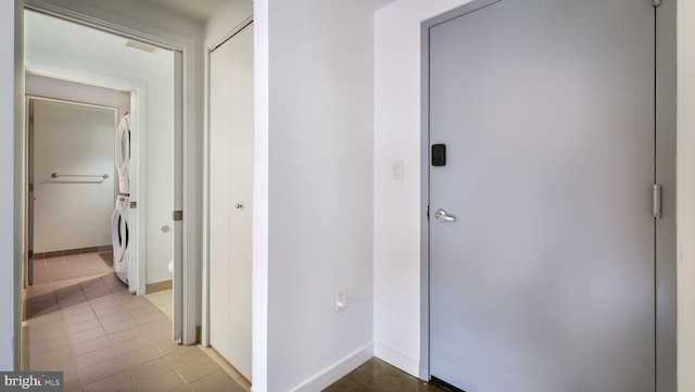 444 N 4th St Unit 401, Philadelphia, PA 19123 - hallway with estacked washer and dryer and tile patterned floors