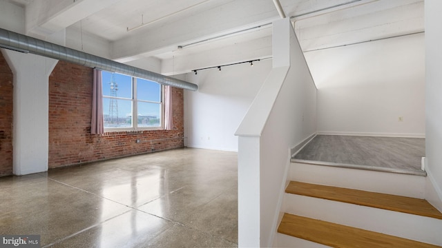 444 N 4th St Unit 401, Philadelphia, PA 19123 - stairway featuring brick wall, beam ceiling, and speckle patterned floor
