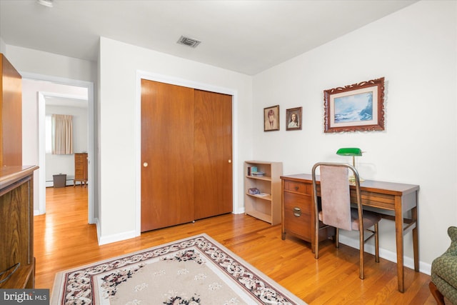 1122 N 14th St, Allentown, PA 18102 - home office with light wood finished floors and baseboard heating