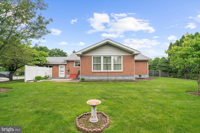 1122 N 14th St, Allentown, PA 18102 - back of house featuring brick siding, a patio, and a chimney