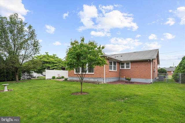 1122 N 14th St, Allentown, PA 18102 - back of house featuring brick siding and a gate