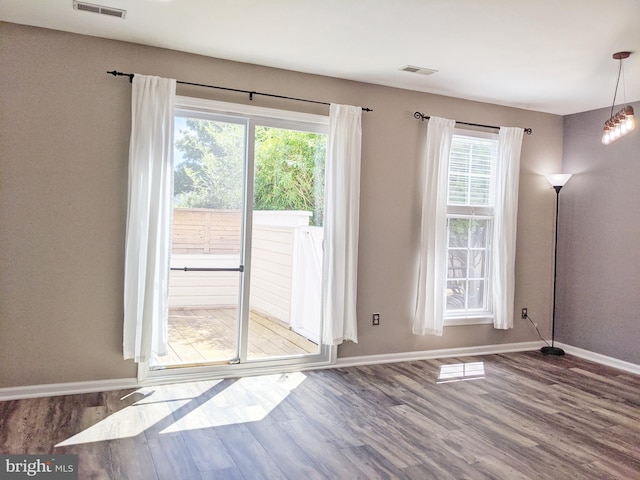 74 Avon Ln Unit 7D, New Hope, PA 18938 - unfurnished dining area with baseboards and wood finished floors