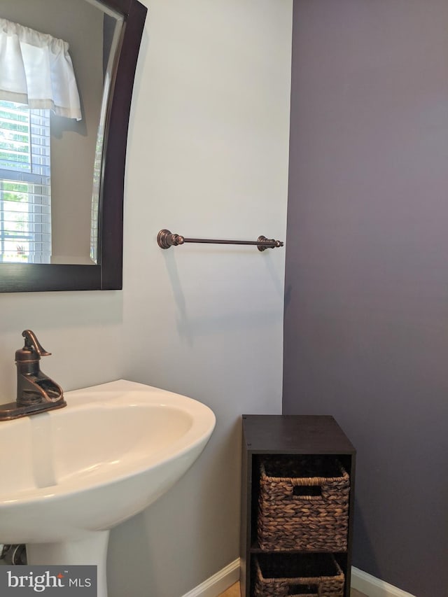 74 Avon Ln Unit 7D, New Hope, PA 18938 - bathroom featuring a sink and baseboards