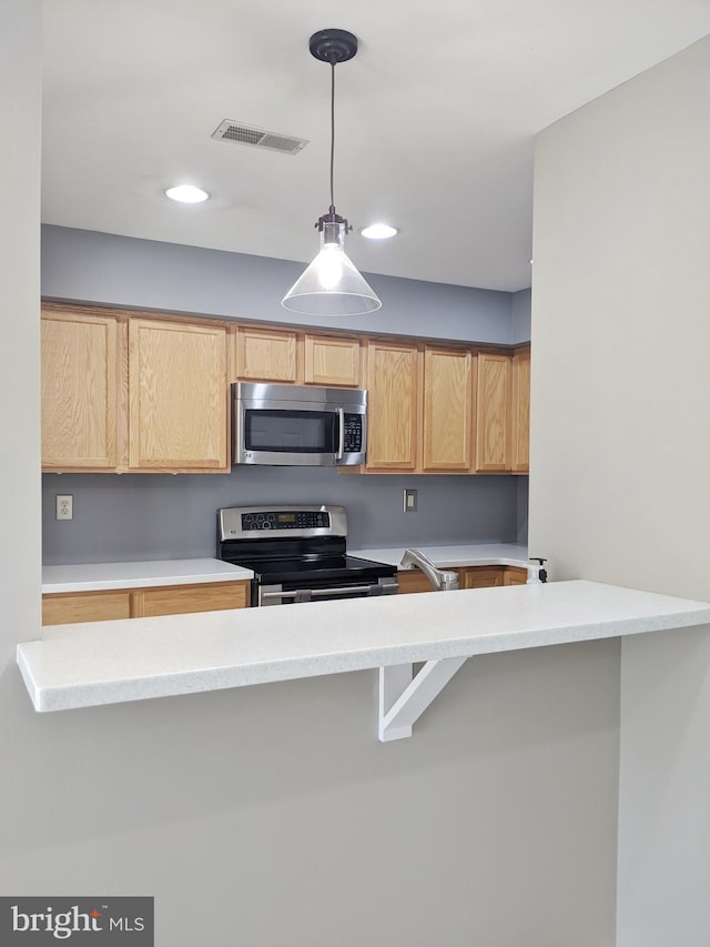 74 Avon Ln Unit 7D, New Hope, PA 18938 - kitchen with stainless steel appliances, recessed lighting, decorative light fixtures, light countertops, and light brown cabinetry