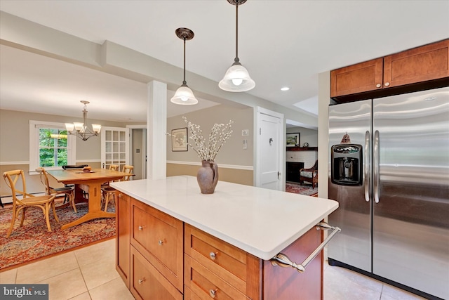 17435 Big Falls Rd, Monkton, MD 21111 - kitchen featuring stainless steel fridge with ice dispenser, light tile patterned flooring, a kitchen island, and light countertops