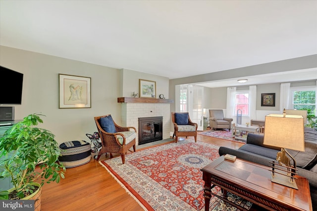 17435 Big Falls Rd, Monkton, MD 21111 - living area with wood finished floors and a brick fireplace