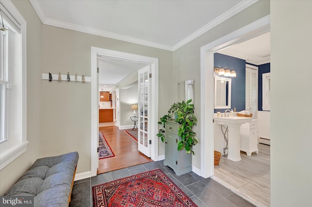 17435 Big Falls Rd, Monkton, MD 21111 - hall featuring dark tile patterned floors, crown molding, and a baseboard heating unit