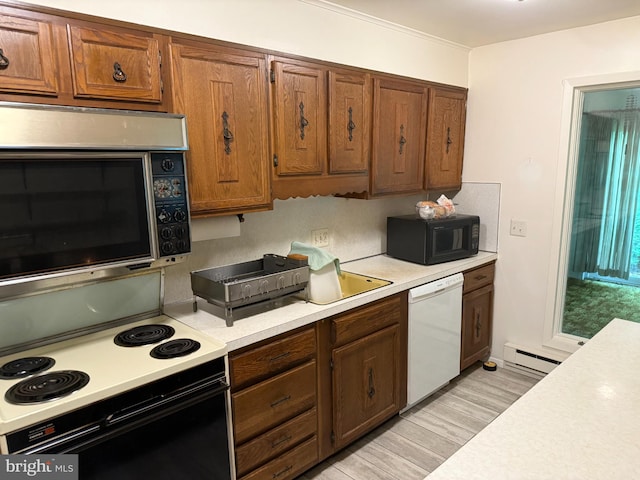 170 E Holly Ln, Tuckerton, NJ 08087 - kitchen featuring white dishwasher, range with electric cooktop, stainless steel microwave, black microwave, and light countertops