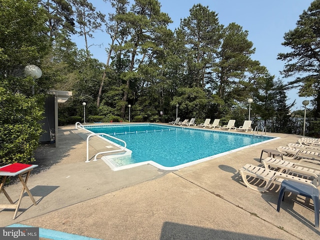 170 E Holly Ln, Tuckerton, NJ 08087 - community pool featuring a patio area and view of wooded area