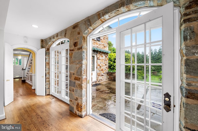 6316 Mossway, Baltimore, MD 21212 - doorway to outside featuring arched walkways, wood finished floors, and french doors